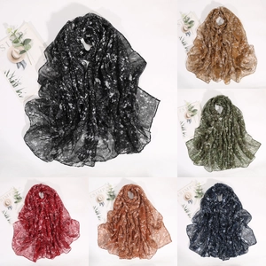Close-up of floral pattern lightweight scarves in black, brown, green and red colors
