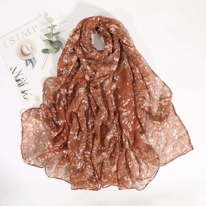 Floral print voile scarf in brown and white with minimalist art card and greenery