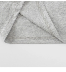 Close-up of double-needle hem stitching on gray knit cotton long-sleeve T-shirt