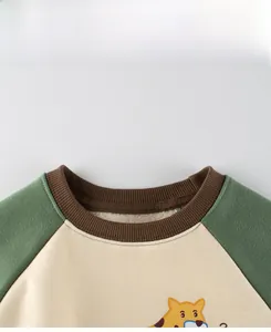 Close-up of children's fleece sweatshirt showing ribbed neckline and warm lining