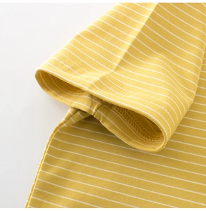 Detail of premium stitching on yellow striped cotton kids t-shirt sleeve and seams
