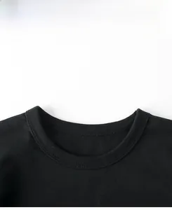 Detail of double-needle stitching on the black cotton crew neck collar for kids