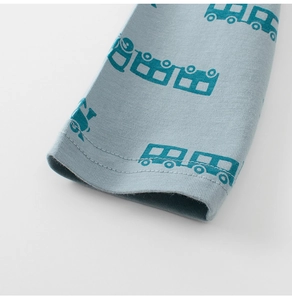 Detailed close-up of double-stitched cuffs on light blue kids cotton long sleeve T-shirt