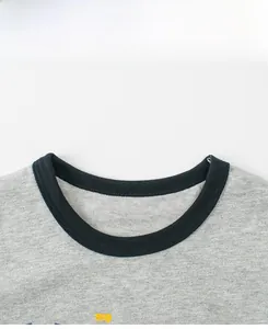 Detail of grey cotton toddler T-shirt with black ribbed contrast crew neck and soft knit texture