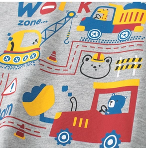 Close-up of kids grey cotton shirt showing detailed excavator and bear print