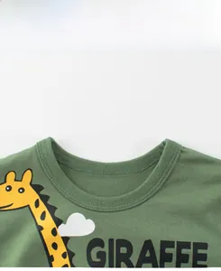 Close-up of olive green cotton t-shirt ribbed neckline with yellow giraffe print