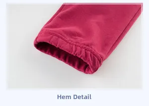 Detailed close-up of pink boys jogger pants leg opening with neat sewing craftsmanship