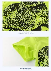 Detail of neon green boys' T-shirt showing dinosaur print and neat cuff stitching