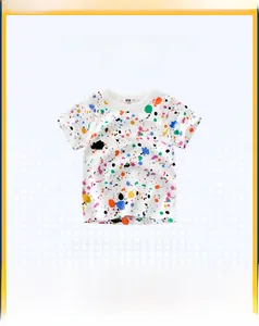 Detailed view of kids white cotton T-shirt featuring vibrant colorful paint splatter print