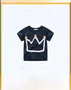 Detail of navy cotton boy t-shirt showing the round collar and white crown print
