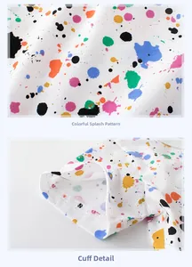 Detail of colorful splatter print and double-stitched cuffs on white toddler t-shirt