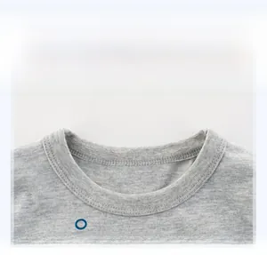 Detail of reinforced crew neck stitching on grey cotton-blend kids t-shirt