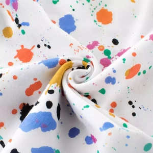Kids cotton T-shirt with artistic colorful paint splash print on white fabric