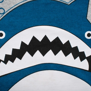 Kid's cotton T-shirt featuring a blue and white cartoon shark print with sharp teeth