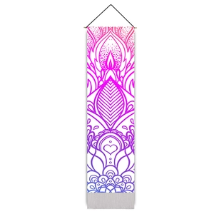 Detailed mandala tapestry hanging featuring vibrant pink and blue gradient on fabric