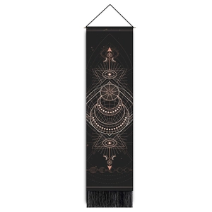 Detail of black tarot tapestry with gold geometric moon phases and hanging tassels