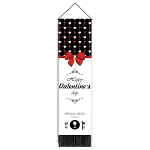 Detailed view of Valentine's day banner with heart beads, red bow, and black tassels
