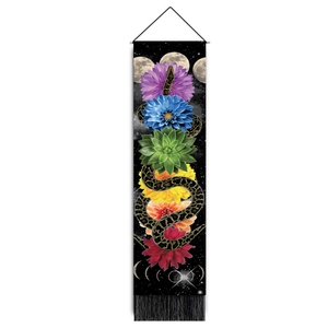 Detail of bohemian snake tapestry featuring seven floral chakras and black fringe accents