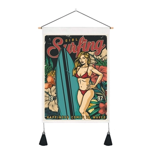 Detail of vintage surfing girl wall tapestry with wooden rod and black tassels