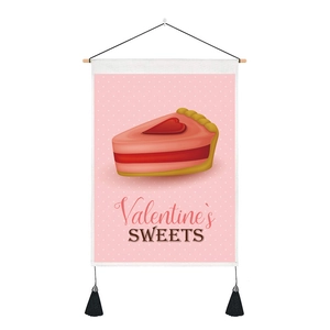 Detail of Valentine's Day wall hanging with sweet cake design and black tassels