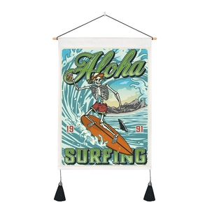Detail of vintage surf tapestry with skull, surfboard, wood rod and black tassels