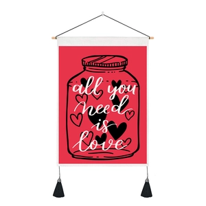 Detail of red Valentine tapestry with heart jar design and white text all you need is love