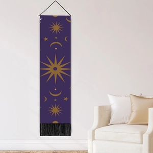 Modern wall tapestry with celestial gold moon and star patterns and black tassels