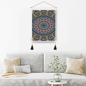 Bohemian mandala wall tapestry with wood rod and black tassels in a modern living room