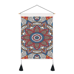 Bohemian mandala tapestry with wooden hanger and black tassels on a white background