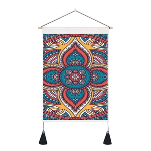 Detail of bohemian mandala tapestry with wooden pole and black hanging tassels