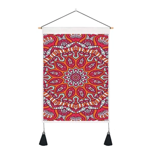 Detail of bohemian mandala tapestry with wooden hanging rod and black tassel accents