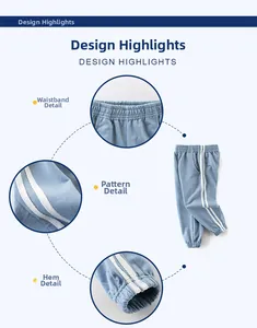 Detail view of boys' blue sports pants showing elastic waistband and ribbed ankle cuffs