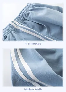 Detail of waffle knit fabric and white side stripes on blue boys joggers