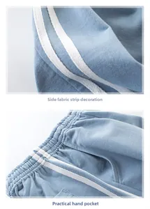 Detail of blue boys jogger pants with side stripe decor and elastic waist side pockets