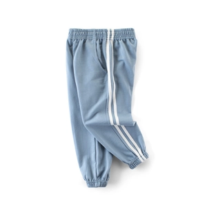 Boys light blue sporty sweatpants with side stripes and elastic ribbed cuffs