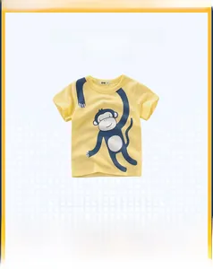 Detail view of yellow cotton t-shirt for kids with blue cartoon monkey print and crew neck