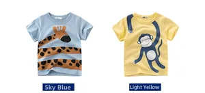 Detailed flat lay of cotton boys' t-shirts with giraffe and monkey animal prints