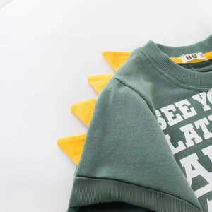 Green cotton kids sweatshirt with yellow dinosaur spikes and SEE YOU LATER text print