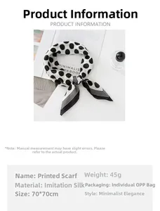 Detailed view of 70cm polka dot silk square scarf tied as a bow on a lifestyle magazine