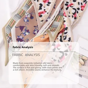 Detail of printed satin scarves showing silky texture and leopard dot patterns