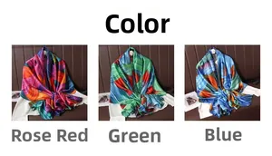 Detail of vibrant abstract line prints on silky satin scarves in rose, green, and blue