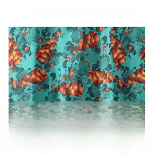 Detail of teal satin fabric with red ginkgo leaf patterns and refined silk texture