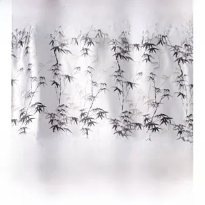 Close-up of elegant bamboo leaf print on smooth white faux silk satin fabric material
