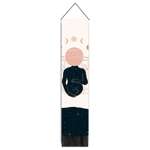 Detail of celestial pregnancy tapestry with starry print and black fringe trim