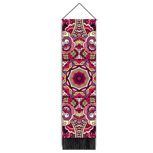 Detailed close-up of bohemian mandala tapestry featuring pink patterns and black tassels