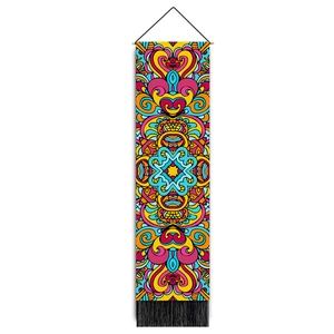Detail view of colorful mandala tapestry featuring geometric patterns and black tassels