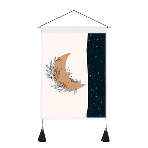 Detail of starry night tapestry with crescent moon, leaves and black tassels