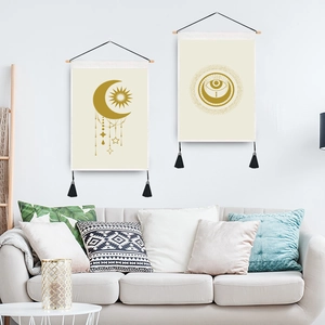 Abstract boho wall tapestry set with sun, moon, and eye patterns on wooden hanging poles