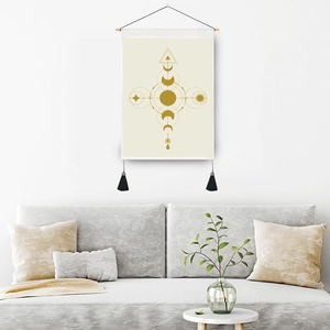 Bohemian sun and moon tapestry with gold geometric patterns and tassels for wall decor