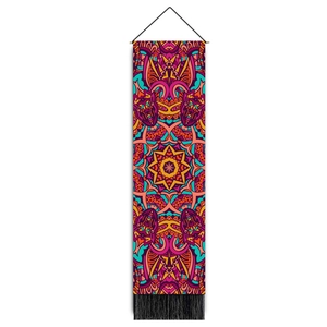 Macro detail of bohemian mandala wall tapestry with vibrant colors and black fringe trim